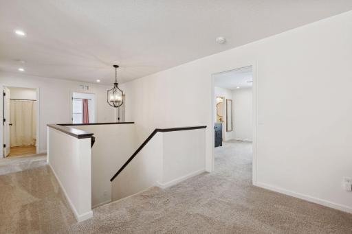 Second floor loft with ample natural light and recessed LED lighting throughout.