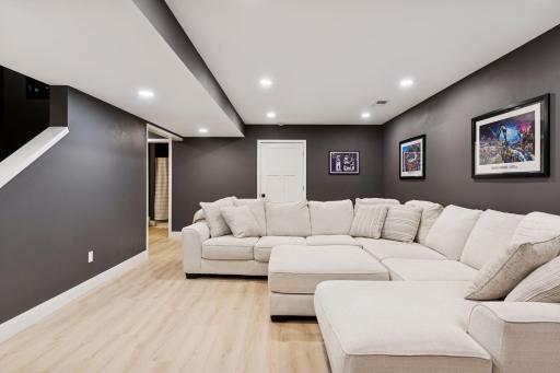Large basement living room perfect for oversized couches and still enough room for space behind for kids play area.