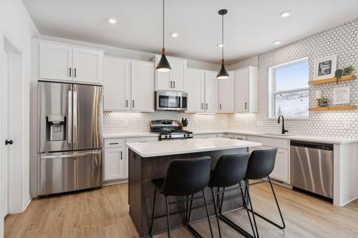 Beautiful white cabinetry with black decorative hardware with soft close drawers and doors.