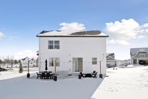 Back patio with planter and string lighting perfect for those summer and fall nights.