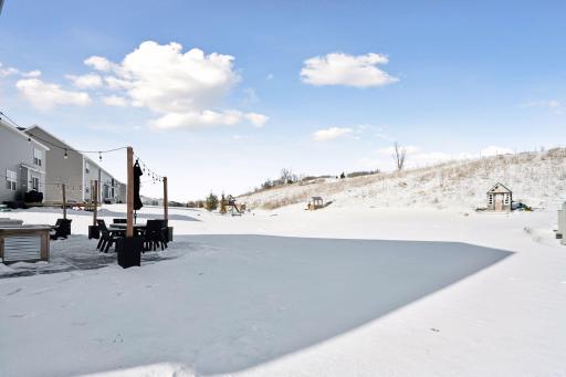 Large backyard with private hill that will not be built on. Perfect for winter sledding and exploring with the neighborhood kids in the summer.