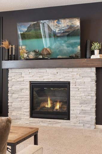 Recently refinished fireplace wall with cohesive finishes to match the rest of the home.