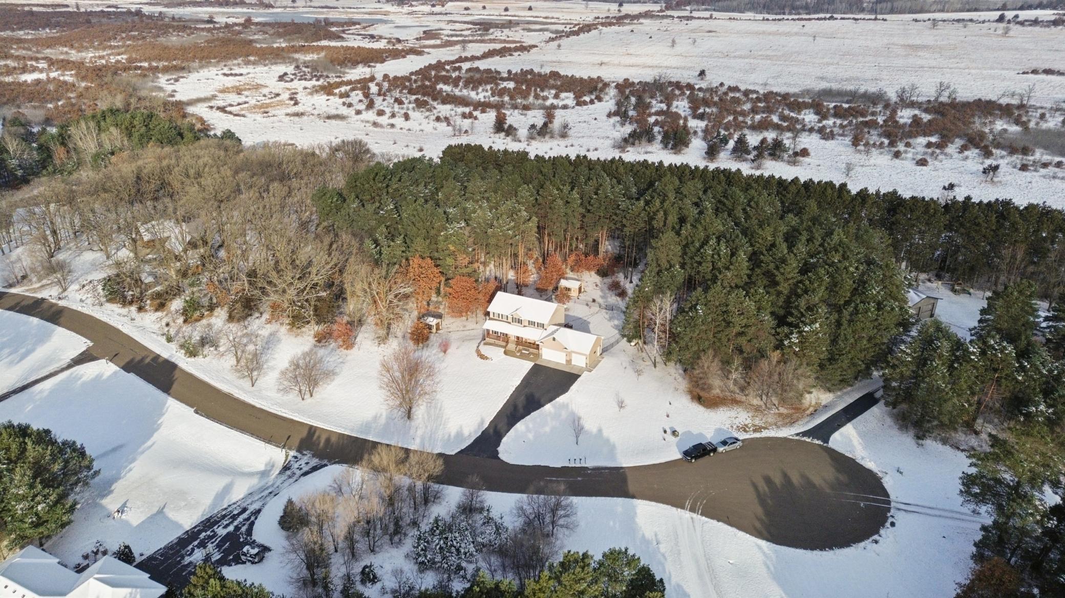 Enjoy the beautiful landscape and quiet neighborhood vibes of being on an acreage cul de sac property.