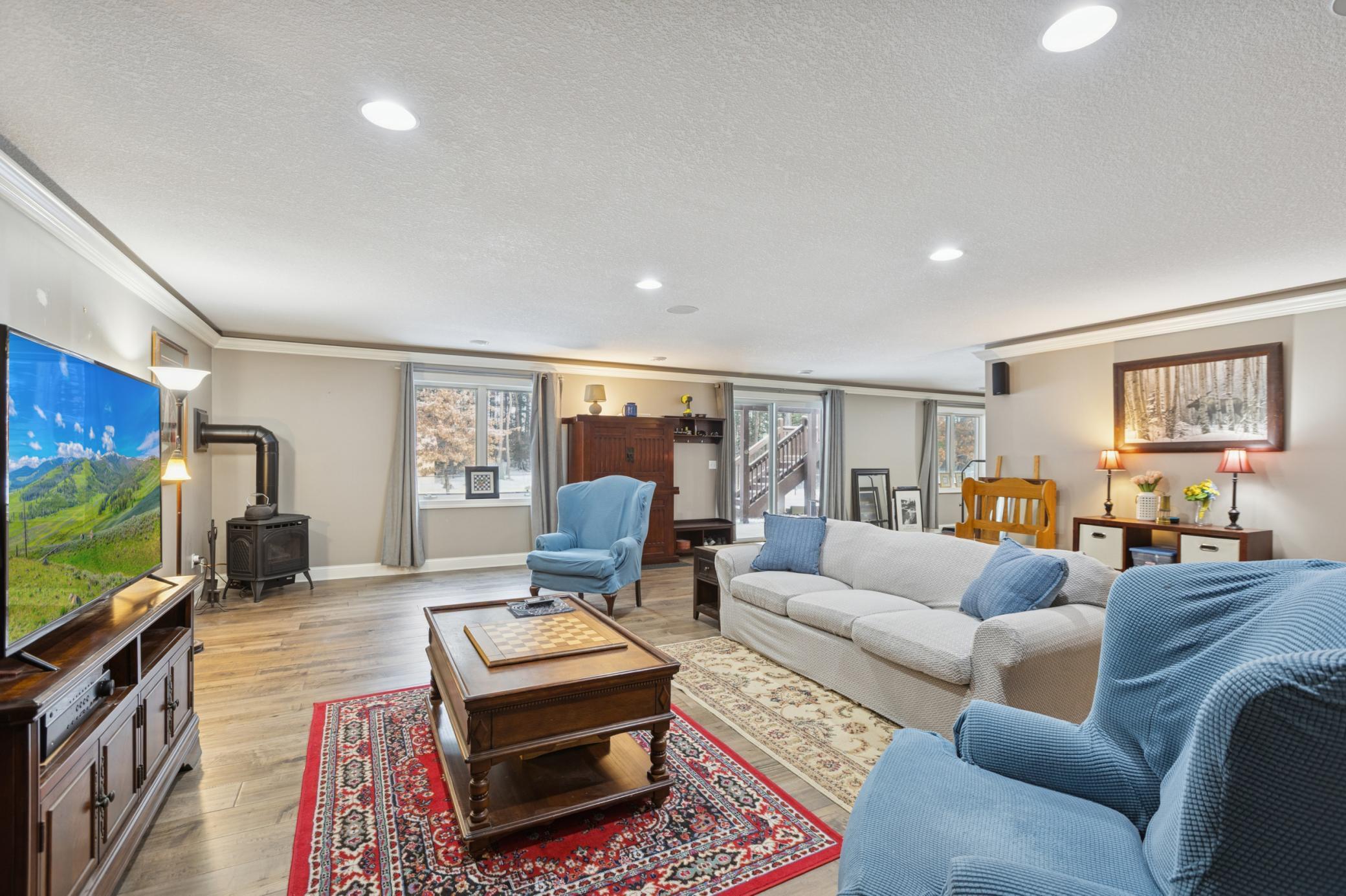 Surround sound, daylight windows, walkout to backyard, and gas stove make this lower level family a great added living space!