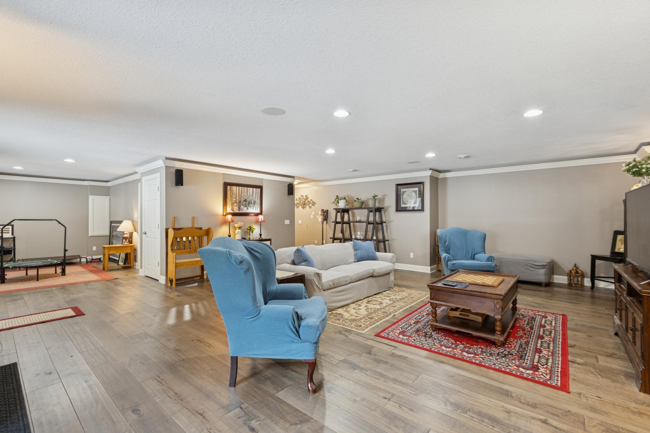 Recessed lighting and runners bring plenty of light into the family room with the flexibility to bring a cozy atmosphere.