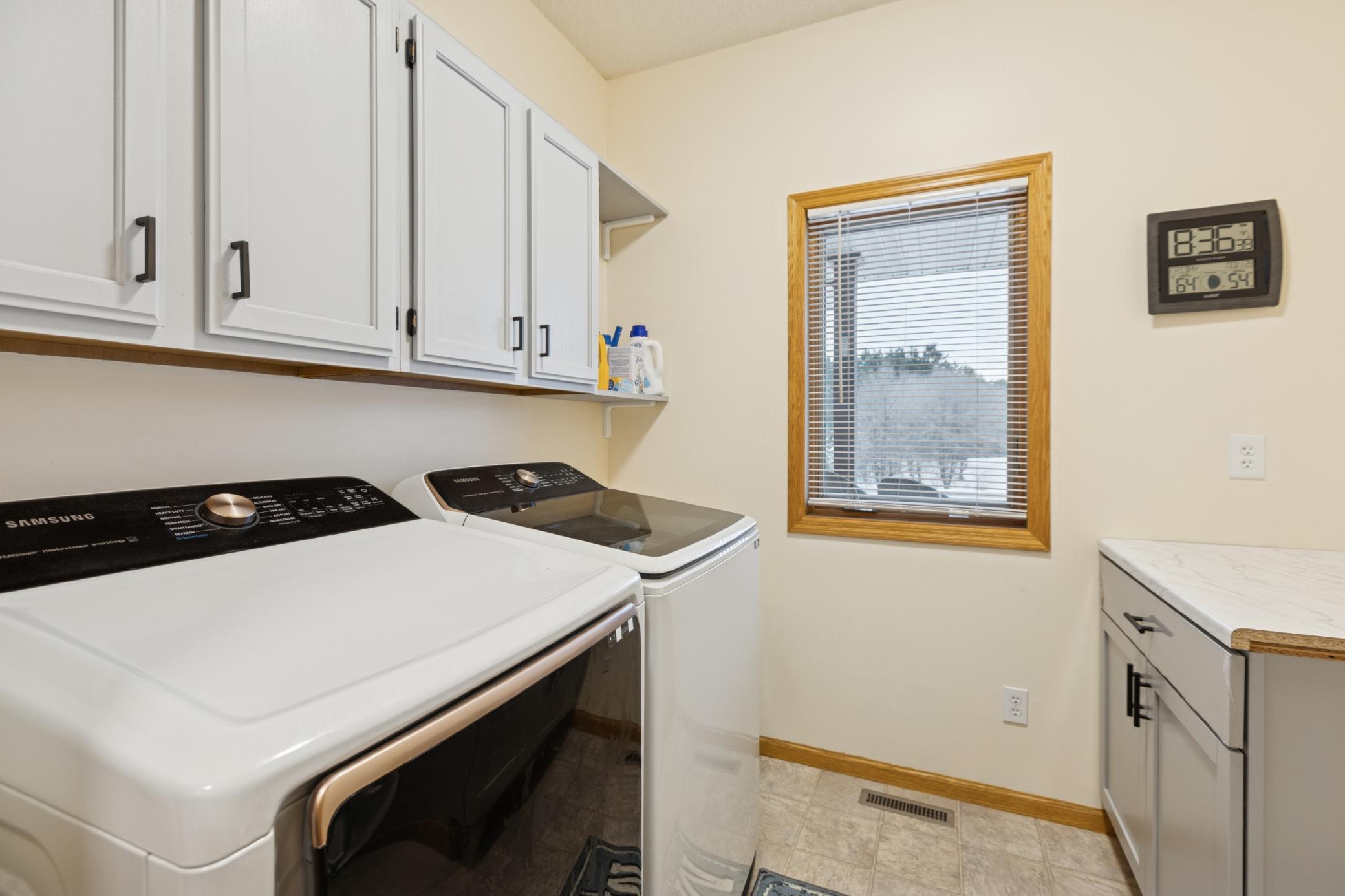 Main floor laundry adds ease and convenience to everyday routines.