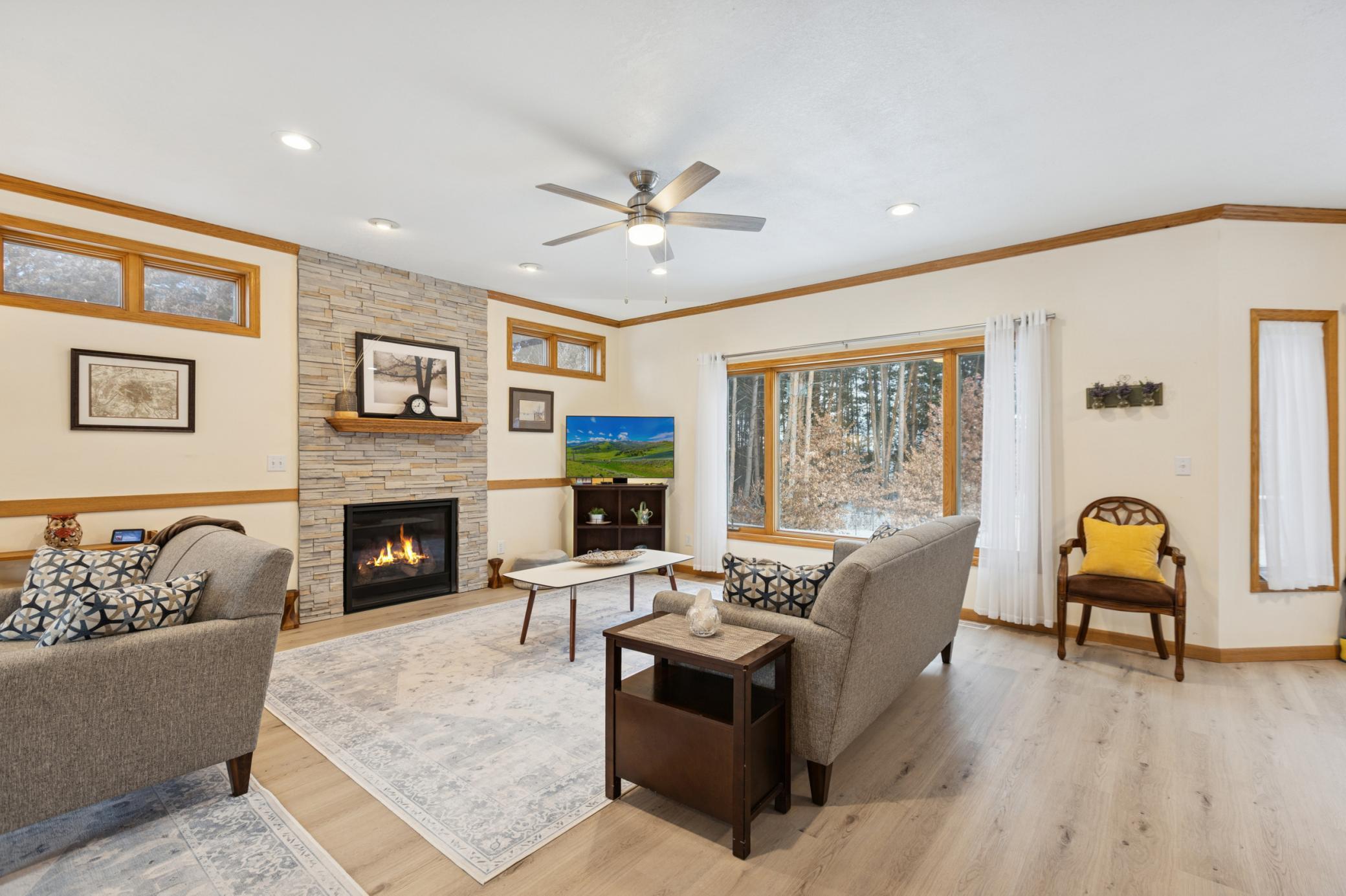 Comfortable living room with fireplace - perfect for cozy evenings (flames enhanced)