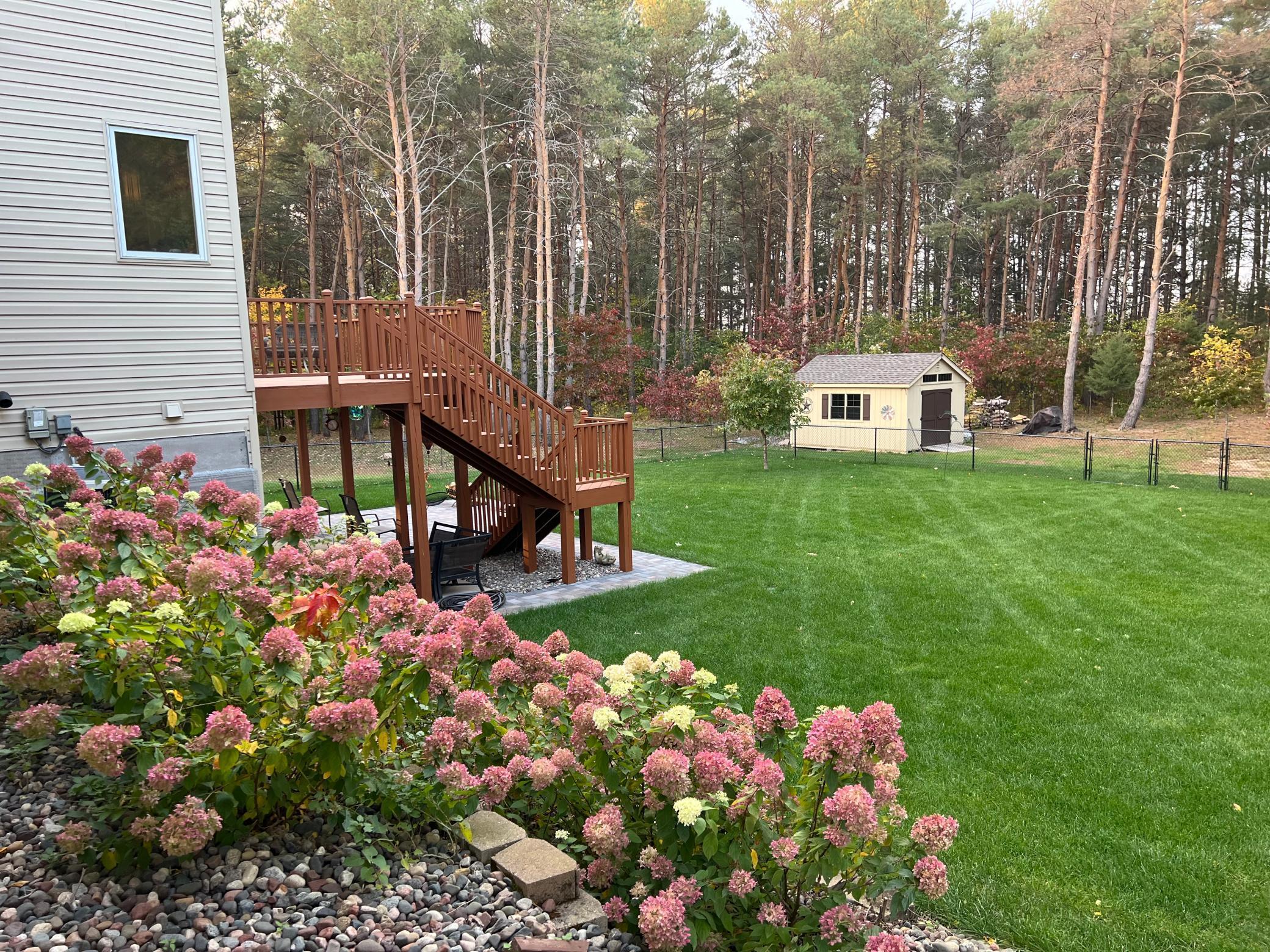 Fenced and landscaped complete with deck, patio, deck and backing up the Sherburne Wildlife Refuge
