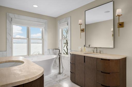 Dual vanities across from each other offering privacy while maintaining a cohesive layout.
