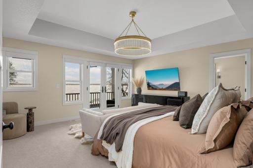Primary suite with lake views, creating a peaceful and inviting retreat.