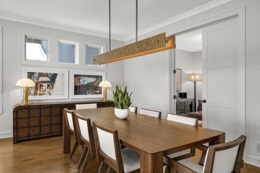 The dining room is perfectly positioned to capture the best of the home with access to the living spaces and unobstructed views of the lake.