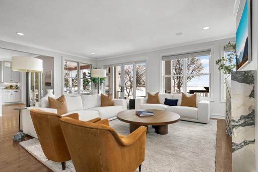 The main floor features hardwood floors and neutral tones. This home blends relaxed lakeside living with a timeless Restoration Hardware aesthetic.