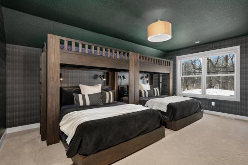 This upper level bedroom offers a generous space and easily doubles as a loft or hangout area. Whether used as a bedroom, multi-purpose loft, the possibilities are endless, and it also features a walk-in closet.