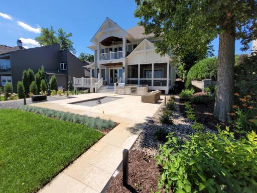 Enjoy the plunge pool, custom landscaping and a built-in gas grilling bar completed within the last 2 years. The heated pool includes color changing lighting and smart mobile app control, perfect for effortless entertaining day or night.