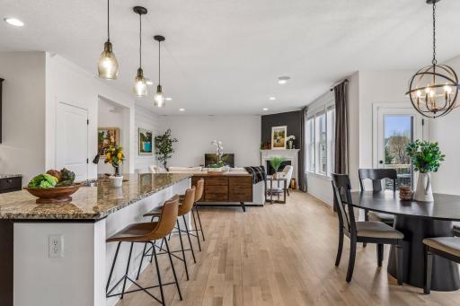 Beautiful oak floors, professionally refinished in 2024, offer a fresh, move-in-ready feel throughout the main level.