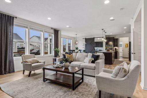 Seamless connection between living, dining and kitchen spaces.