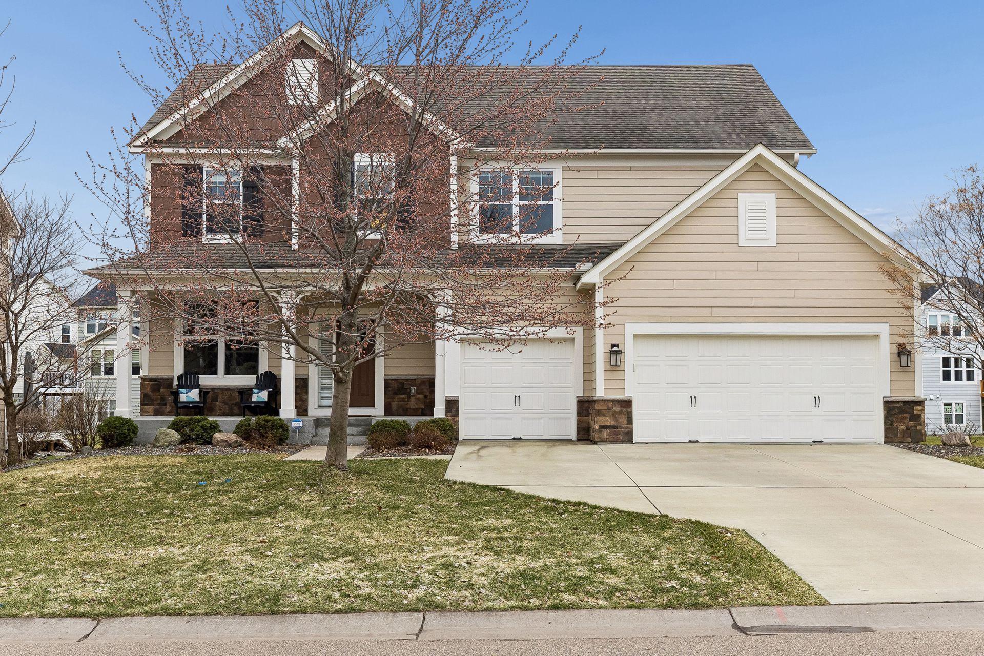Classic curb appeal with a welcoming front porch and three-car garage. A home that makes a statement from the street.