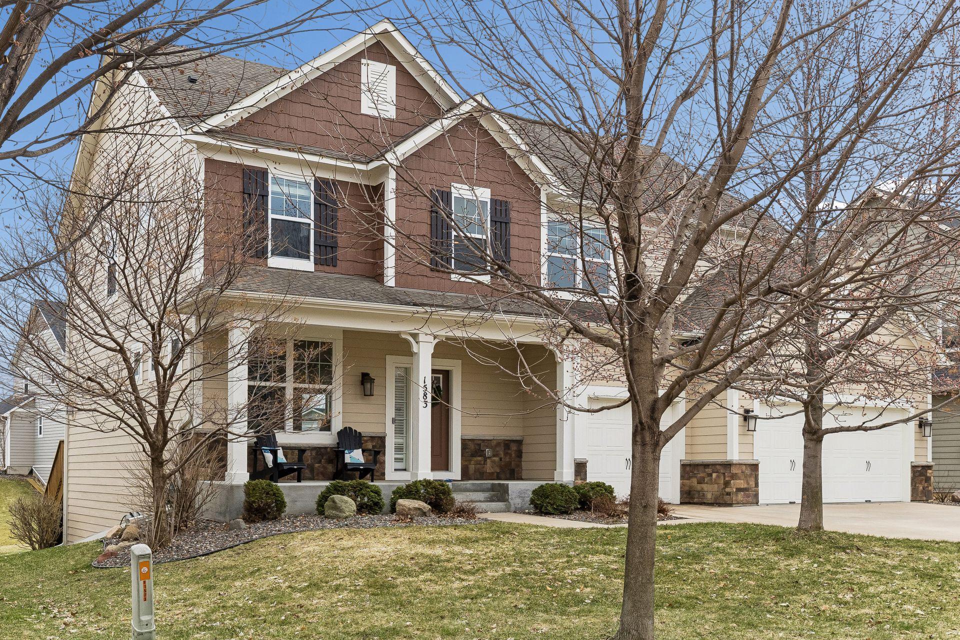 Thoughtful landscaping leading to a warm, inviting entry.