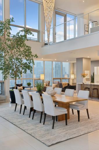 Exceptional Riverfront Penthouse at The Phoenix! 5600 sq. ft. with 3 Bedrooms and 4 Bathrooms including two primary suites, breathtaking views, and exclusive access to a semi-private elevator from four garage stalls directly to unit.