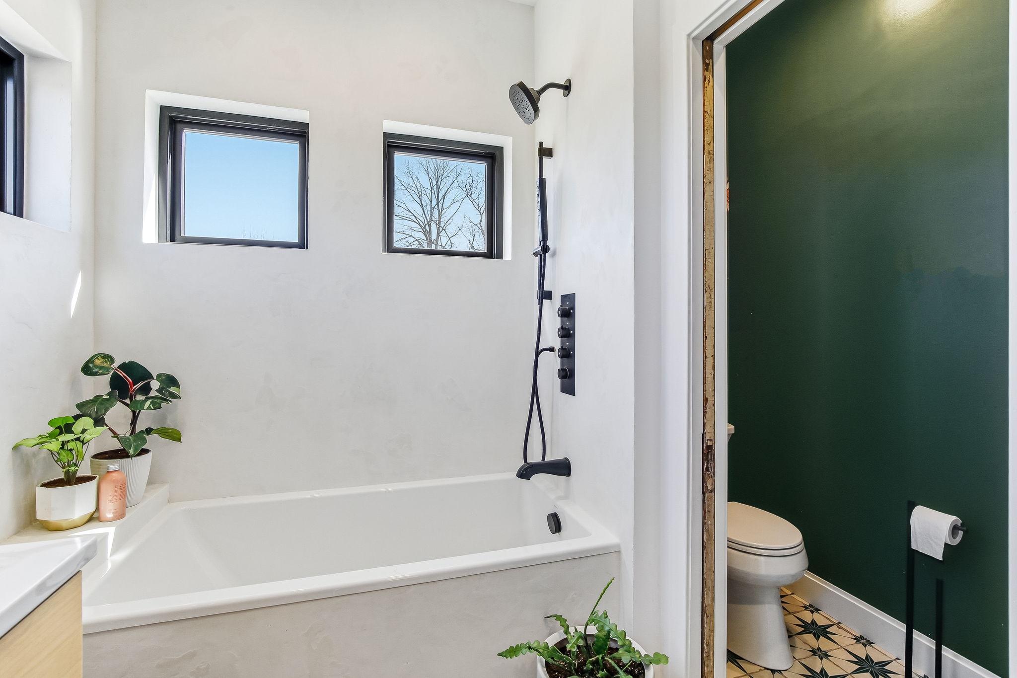 Private toilet area with a space-saving pocket door, combining convenience and thoughtful design.