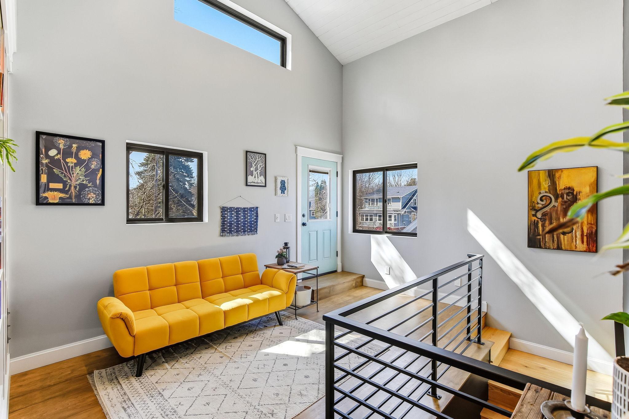 Sun-drenched- featuring expansive windows that bring in abundant natural light.