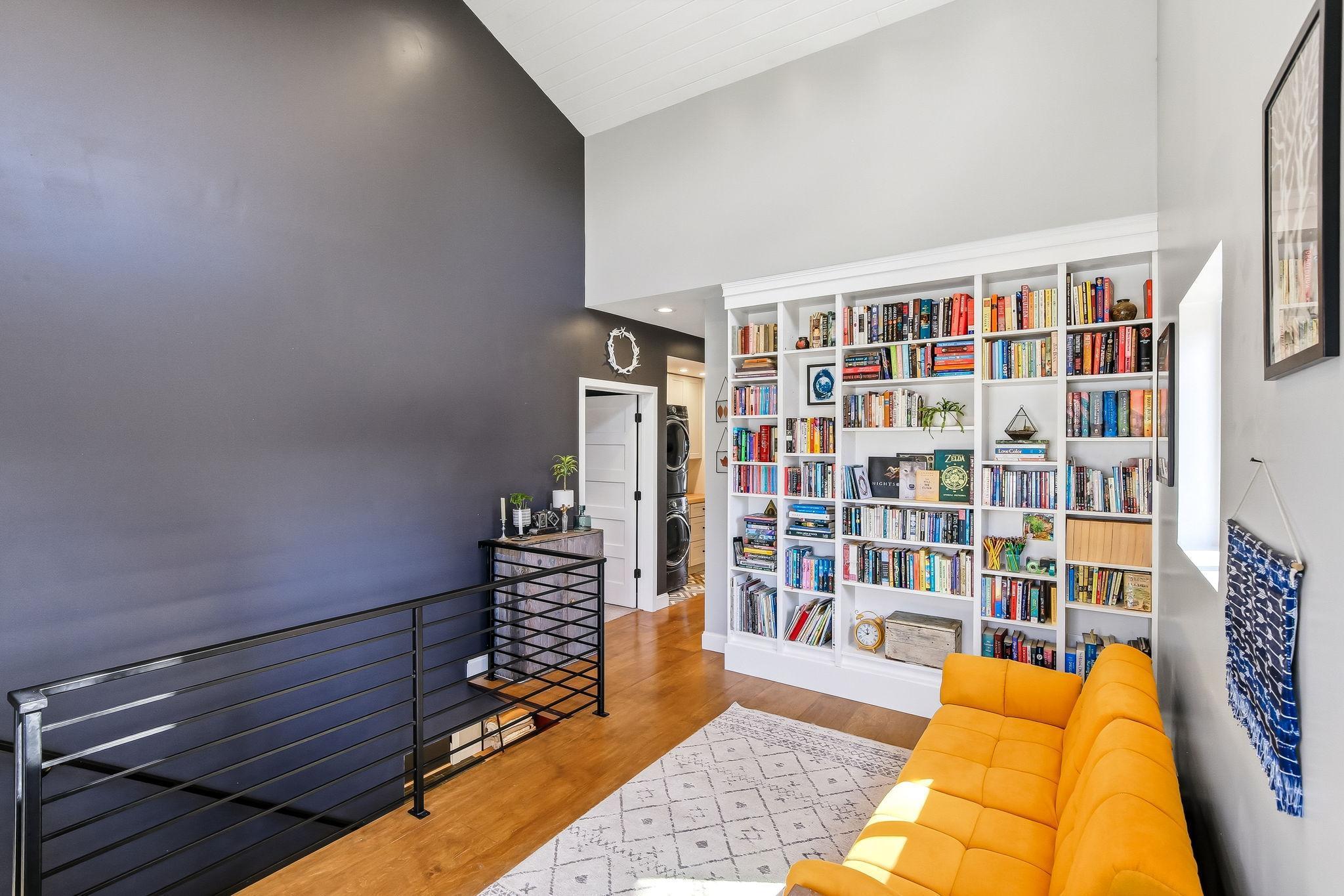 Dramatic high vaulted ceilings create an open, airy, and light-filled space.