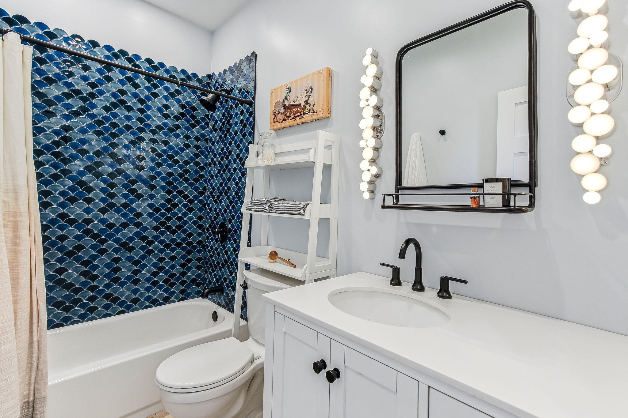 Contemporary second-floor bathroom with designer touches and modern amenities.