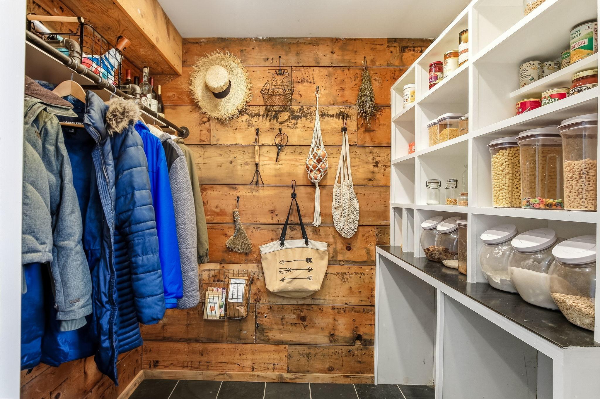 Charming separate pantry featuring original shiplap, blending vintage character with practical storage.