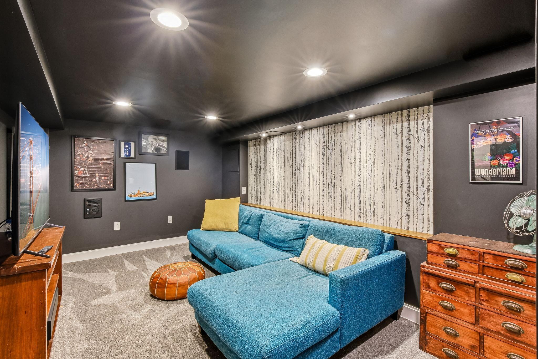 Inviting lower-level family room ideal for movie nights, games, or relaxation.