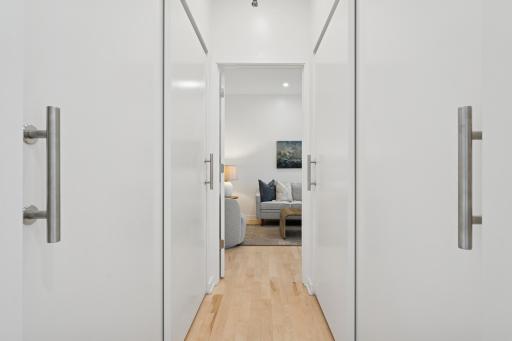 A bright hallway leads to the upper-level bedroom, with additional closet space for optimal storage and function.