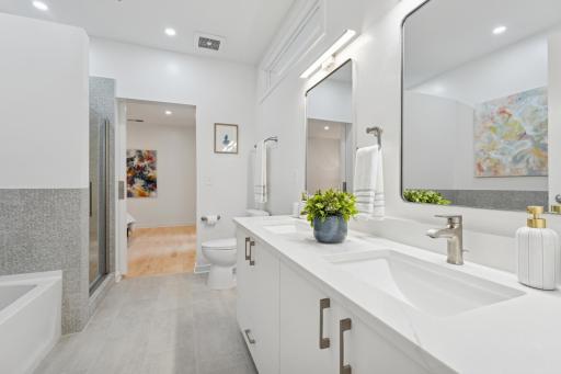 A dual-sink vanity offers daily luxury with ample space and refined finishes—ideal for peaceful morning routines.