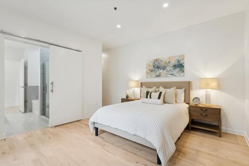 The spacious main-level primary suite is a true retreat, complete with a private en-suite bath and walk-in closet.
