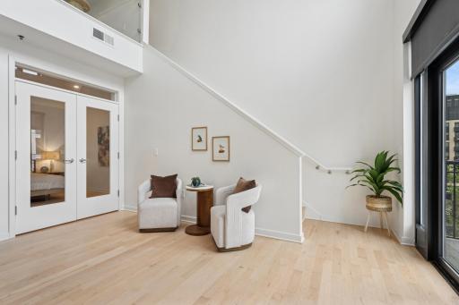 This additional lounge space near the main-level primary bedroom offers quiet comfort for relaxing, reading, or winding down.