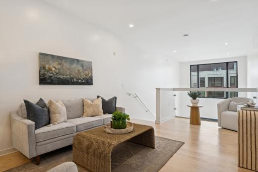 Upstairs, the airy loft offers endless possibilities—use it as a media lounge, creative studio, or cozy guest hangout.