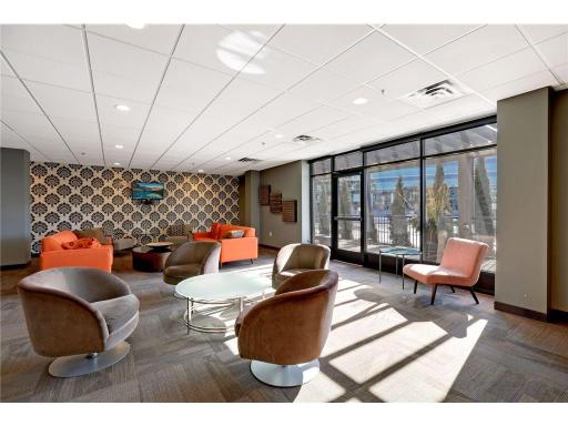 One more thing to love about life at The Loop—an inviting community lounge and party room, designed for hosting gatherings, watching the big game, or connecting with neighbors in a stylish, relaxed setting.