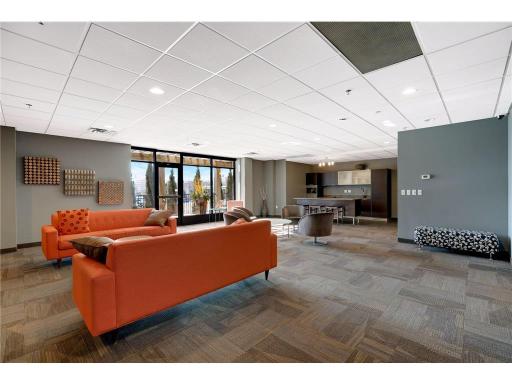 One more thing to love about life at The Loop—an inviting community lounge and party room, designed for hosting gatherings, watching the big game, or connecting with neighbors in a stylish, relaxed setting.