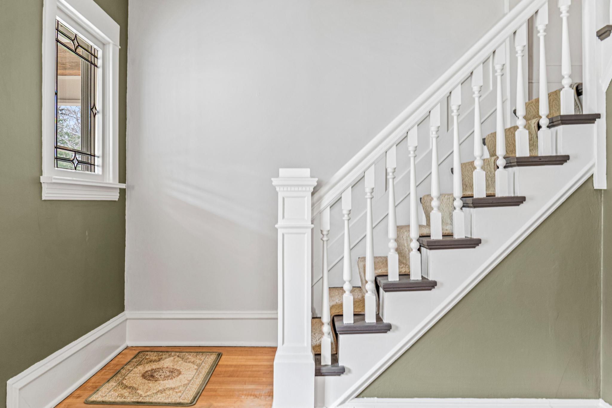 1 OF 2 STAIRCASES TO THE UPPER LEVEL