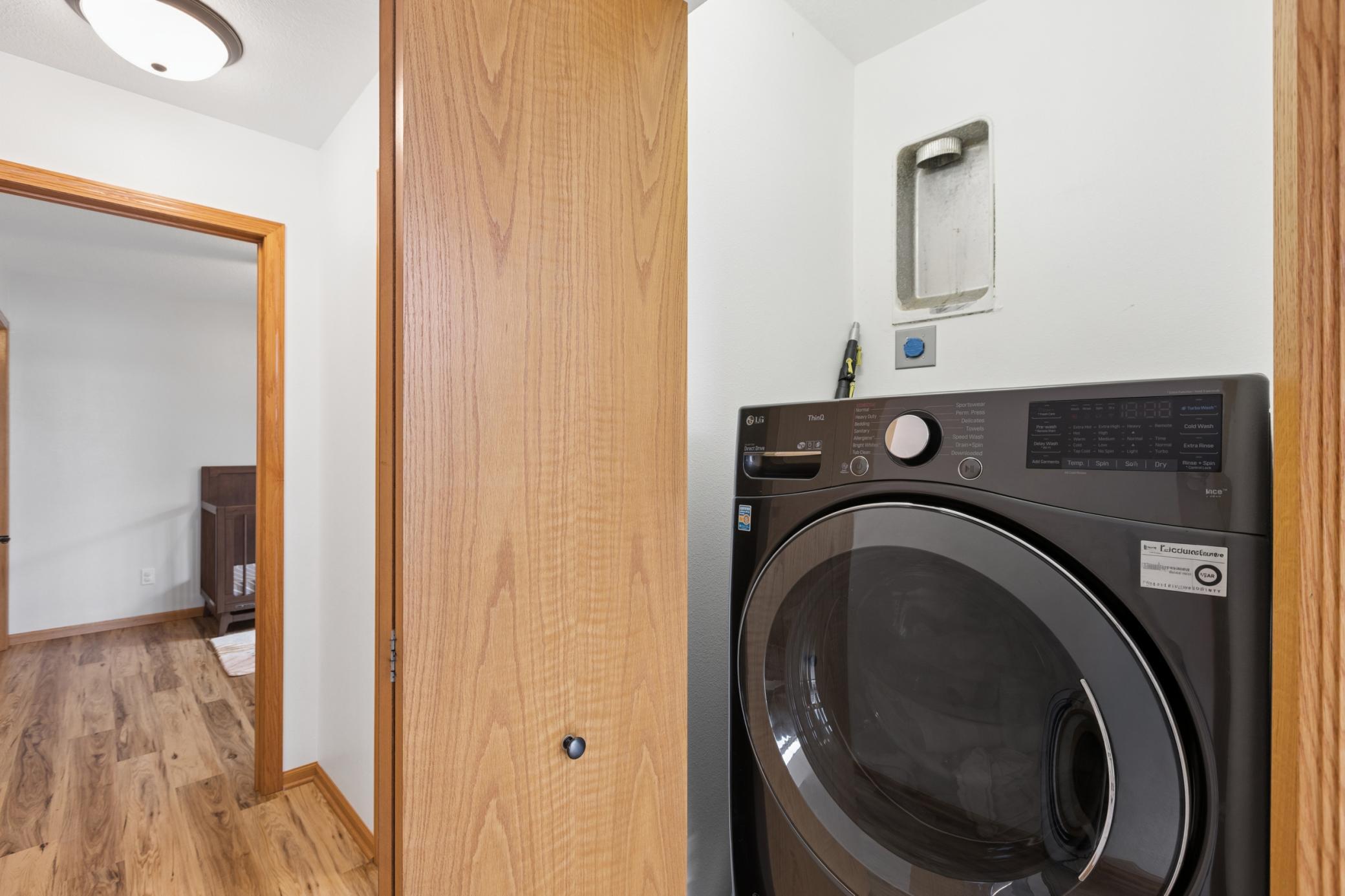 Conveniently located near the kitchen and the two main floor bedrooms is the laundry closet. Set up to have gas or electric dryer and currently using an all-in-one washer/dryer with a sidekick washer pedestal underneath.