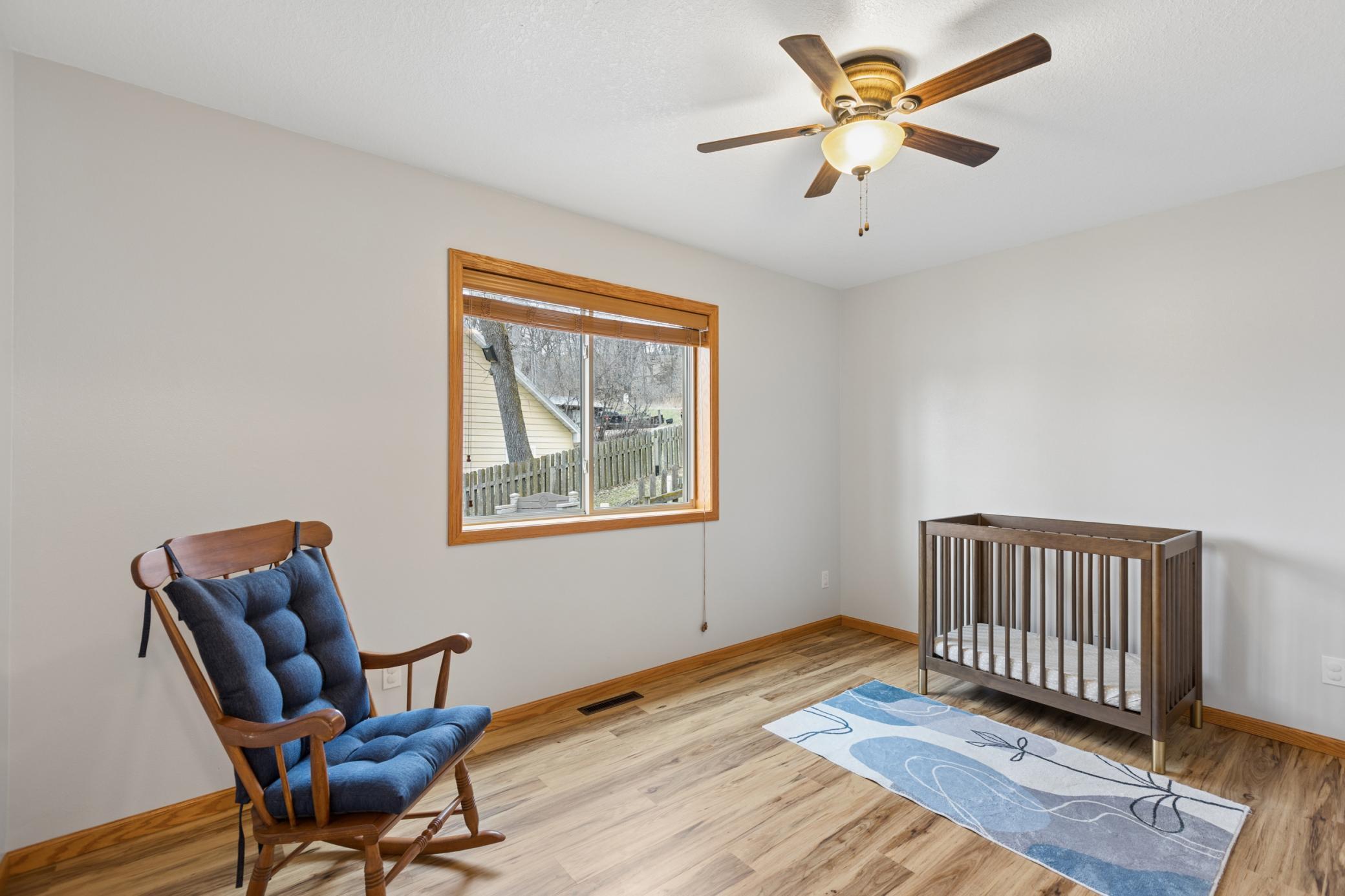View of the second main floor bedroom. This home is move in ready for you to start enjoying all that Lake Louisa has to offer.