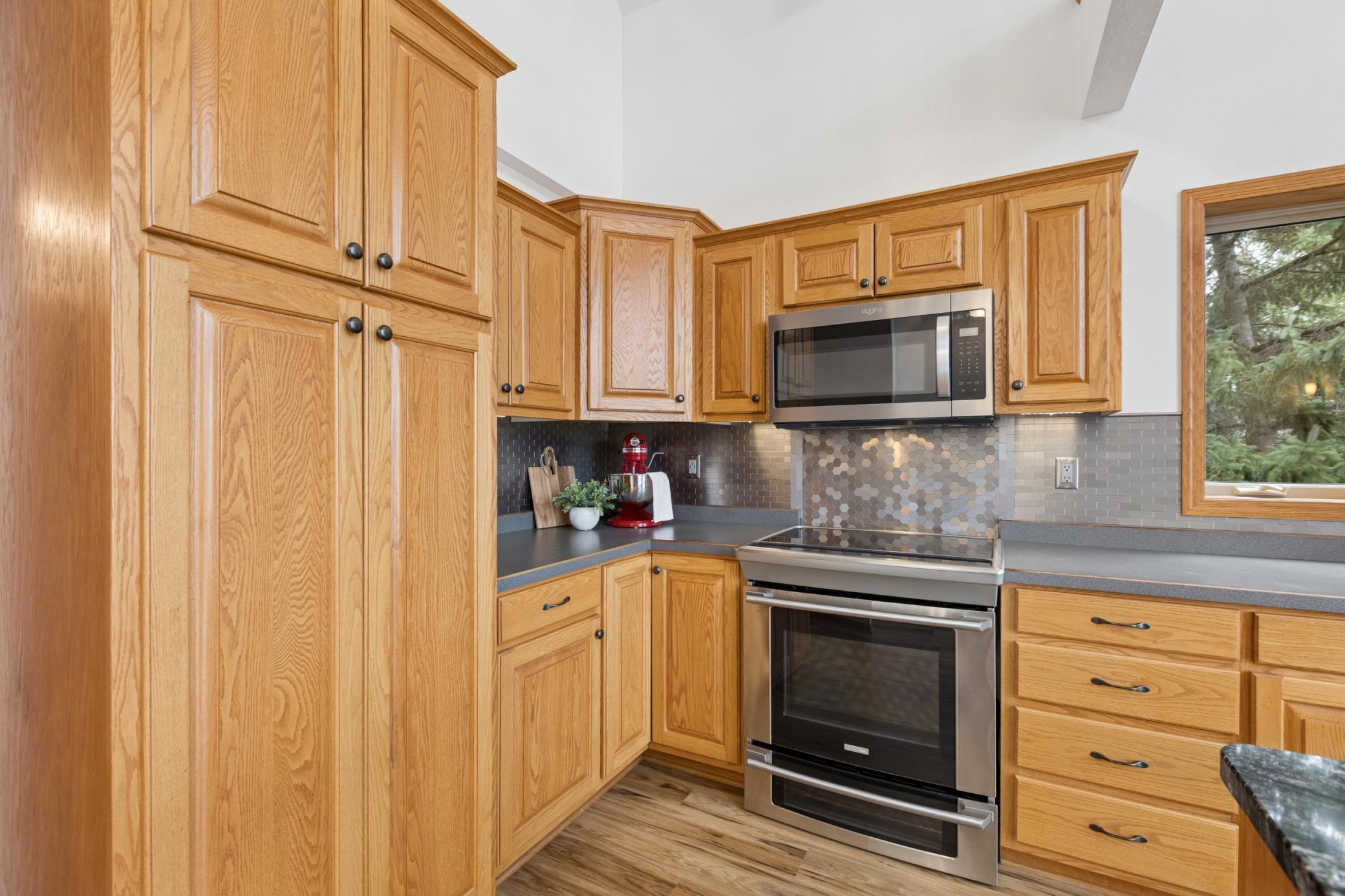 The electric range has an induction cooktop. There is also a gas line behind the range if a gas cooktop is more your style. There are small things throughout this home that make it apparent that this was a well thought out custom build.