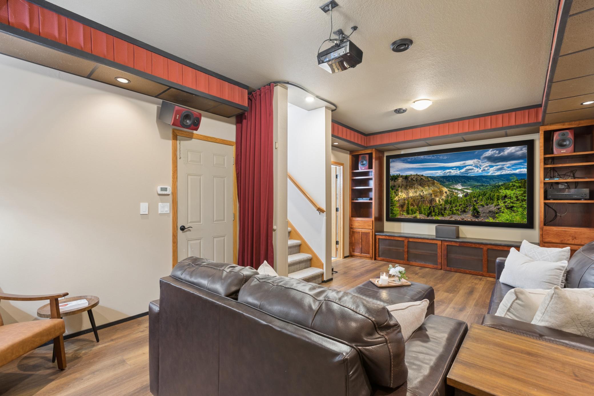 The lower level of the home is the attached garage, utility room, media/theater room and a three quarter bath. The garage space was previously used as additional living space.