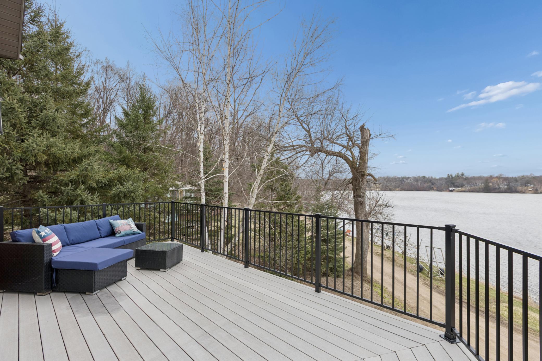 From the lakeside deck you can watch the sun setting to the West over Lake Louisa. You will appreciate the composite decking with metal railings on the wrap around deck that make this home very low maintenance along with the steel siding.