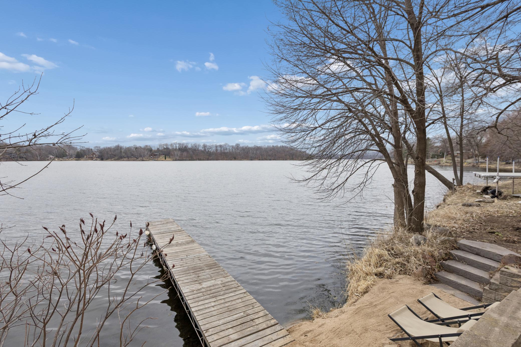 Kickback and relax at the sand beach leading to Lake Louisa. The terraced landscaping provide multiple areas to enjoy the tranquility of Lake Louisa.