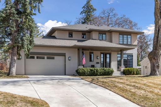 Refined Modern Design. Social space on the front porch. Extra parking in the driveway
