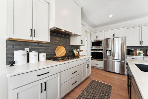 Gas cooktop with vented wood hood option.