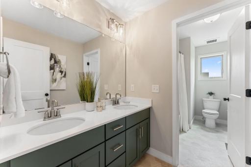 Shared bathroom with private shower.