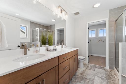 Primarys bath with separate tub and walk-in closet, notice the windows;)