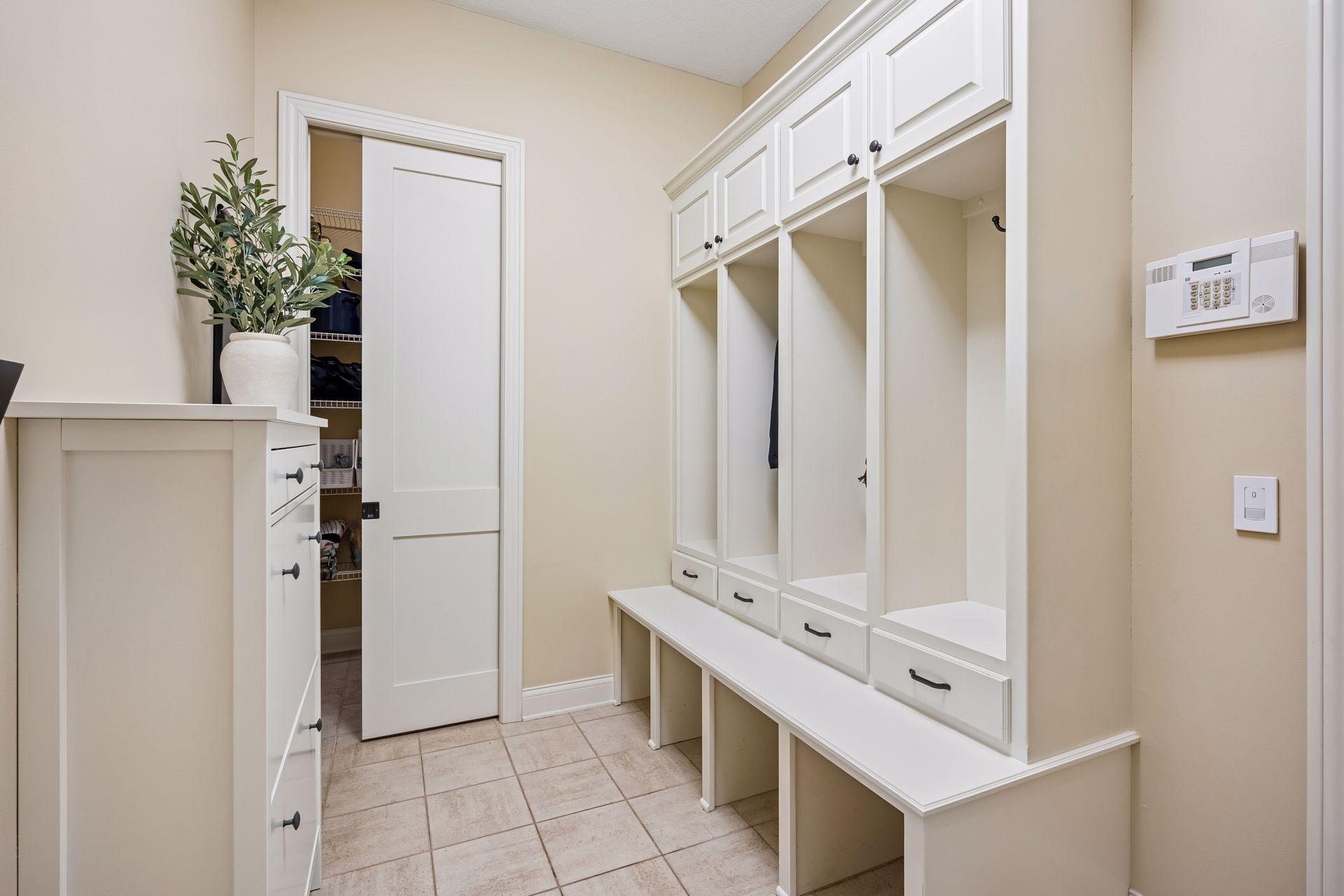 Mudroom with cubbies, shoe storage and a walk-in closet