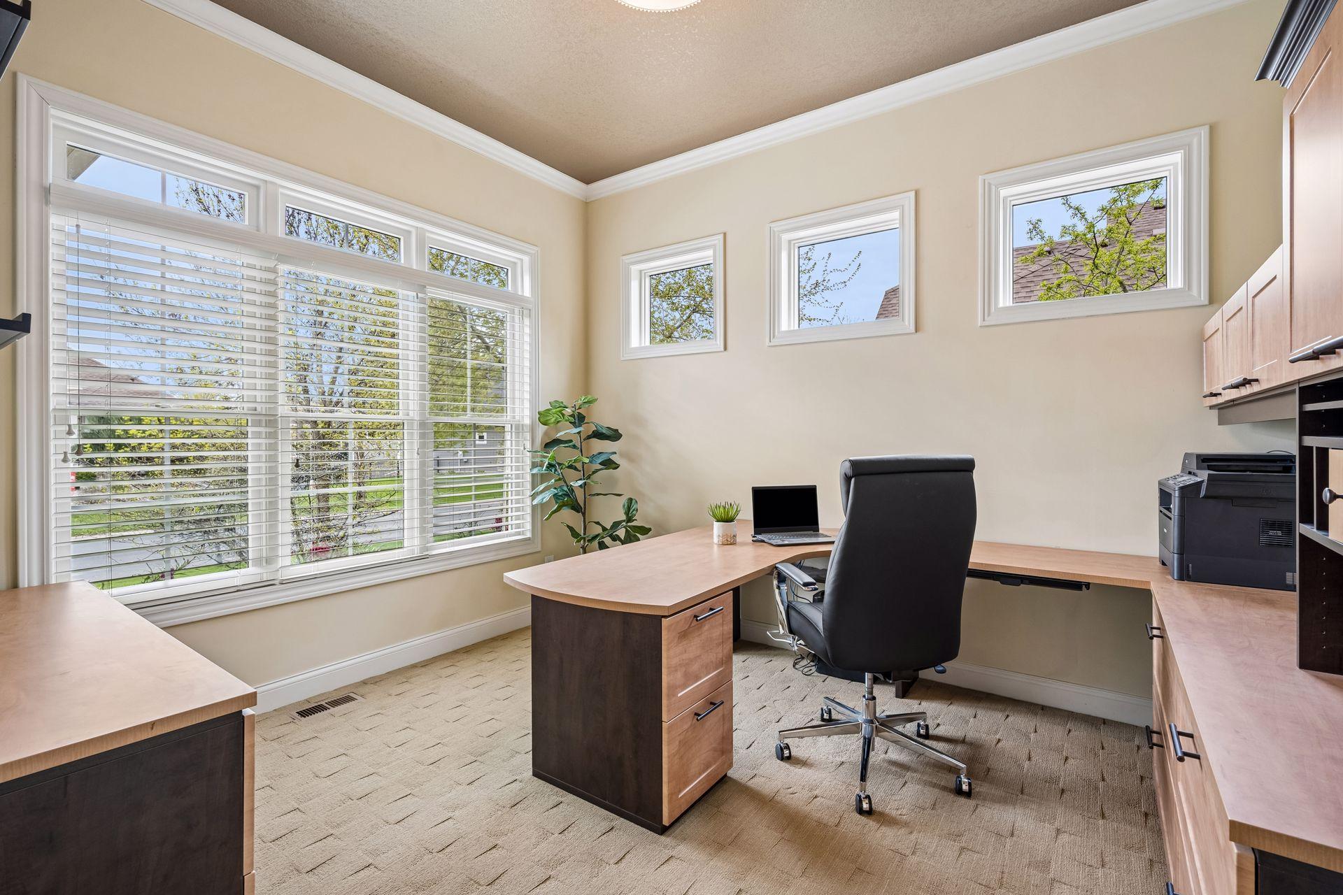 Bright and airy main floor office with double doors