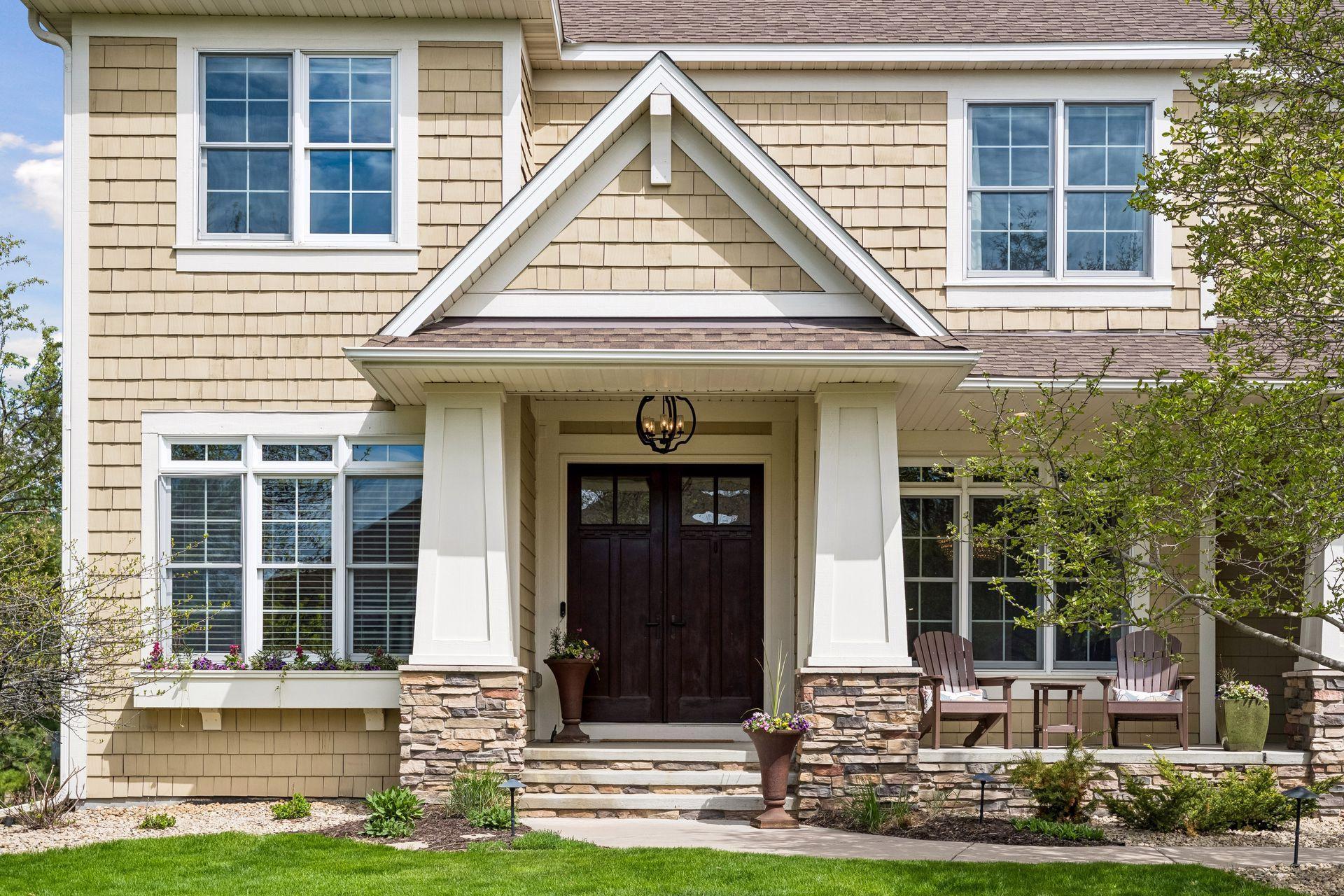 Welcoming front porch with 8' double doors